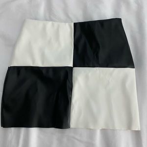 Checkerboard leather skirt.